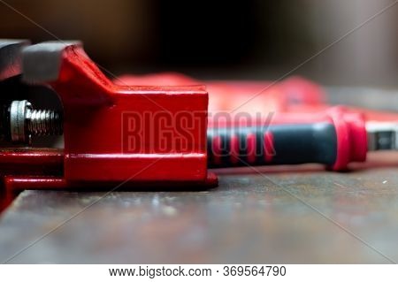 Red Tools On A Work Table On A Black Background, Toolroom Concept