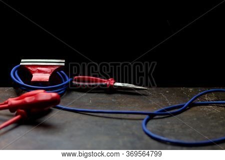 Red Tools On A Work Table On A Black Background, Toolroom Concept