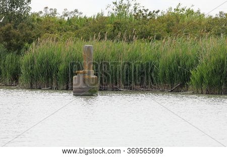 Ancient Well Water Made Of Reinforced Concrete Once Used For The Extraction Of Methane At The Mouth 
