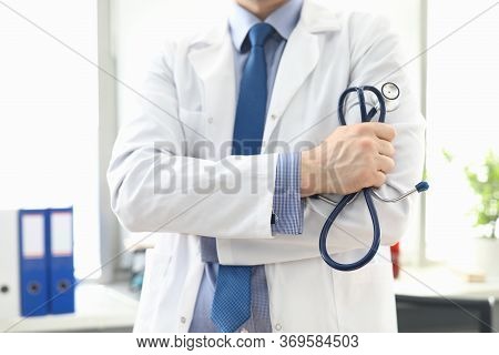 Doctor Standing In Office With Stethoscope In His Hand. Platform For Online Consultation With Doctor