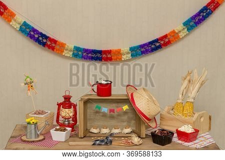 Table Decorated To The Theme `festa Junina`. Prepared With Sweet And Savory Foods Typical Of The Bra
