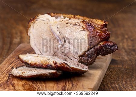 Closeup Of Sliced Bavarian Roasted Pork On Wood