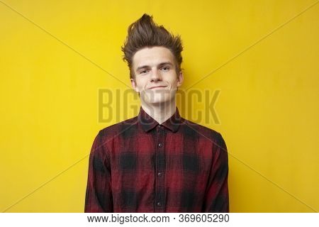 Portrait Of A Guy With A Funny Hairstyle On A Yellow Isolated Background, Hipster With Strong Hair S