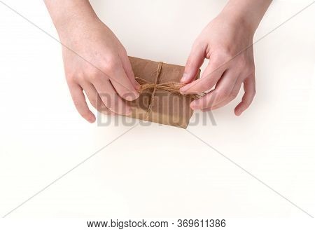 Hands Pack A Gift Box. Space For Text.