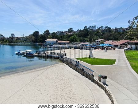 Aerial View Of Lake Mission Viejo, With Recreational Facilities And Beach, Surrounded By Private Res