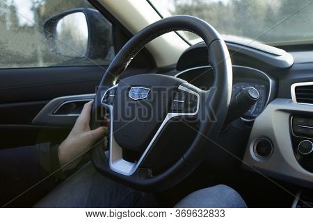 Minsk, Republic Of Belarus. 12.16.2019. Male Hands Hold The Wheel Of A New Car Geely Atlas