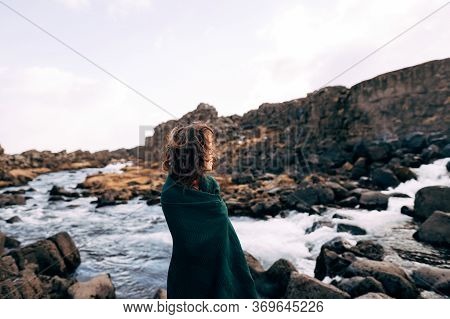 A Girl In A Red Dress Near Ehsaraurfoss Falls, Ehsarau River, National Park, Tingwedlir, Sudurland R