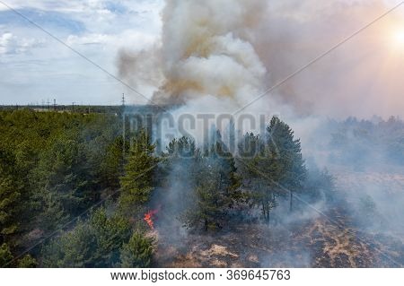 Aerial Drone View Of A Wildfire In Forested Area.
