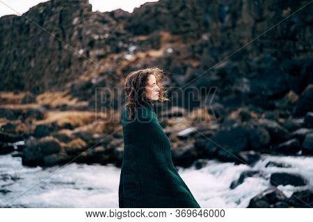 A Girl In A Red Dress Near Ehsaraurfoss Falls, Ehsarau River, National Park, Tingwedlir, Sudurland R