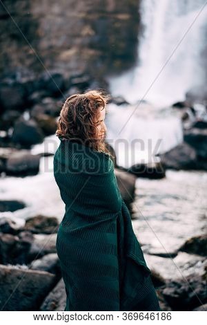 A Girl In A Red Dress Near Ehsaraurfoss Falls, Ehsarau River, National Park, Tingwedlir, Sudurland R