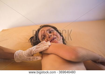 The Child Is Given An Injection, Vaccination, Doctor Makes An Injection With A Syringe To The Boy, T