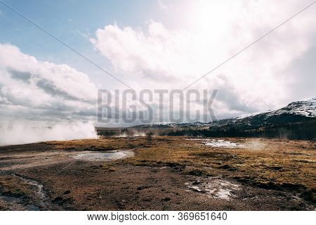 Geyser Valley In The Southwest Of Iceland. The Famous Tourist Attraction Geysir. Geothermal Zone Hau