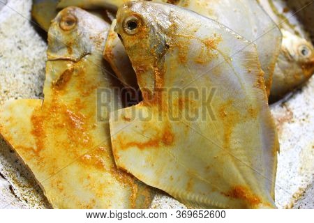 Cropped And Close View Of Sea Fish \'pomfret\'.  Fresh Raw Sea Fish Ready To Cook Display With Selec