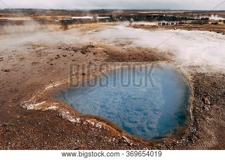 Geyser Valley In The Southwest Of Iceland. The Famous Tourist Attraction Geysir. Geothermal Zone Hau