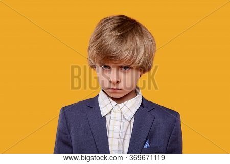 The Dear Boy Was Offended And Put His Head Down. Boy Is Blond In A White Shirt.