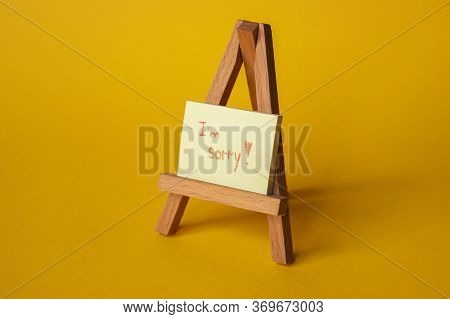 Sticker With Sorry Inscription On A Mini Easel. Im Sorry Lettering.