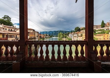 Bassano Del Grappa Town And The River Brenta Seen From The Famous Ponte Degli Alpini Or Ponte Vecchi