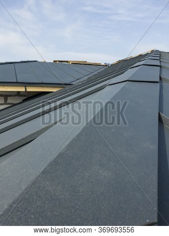 Close Up View Of Scaffolding And House Under Construction With Grey Folding Roof On Waterproofing La