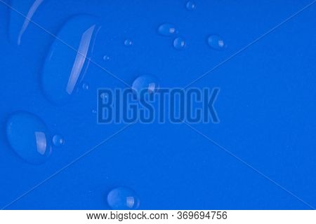 Serum Smear Smudge Swatch With Collagen And Peptides On Blue Background. Skin Care Gel Transparent S