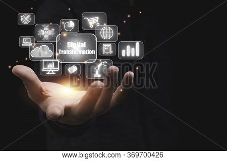 Hand Holding Digital Transformation  With Technology Icons Such As Laptop Computer Graph.cloud Techn