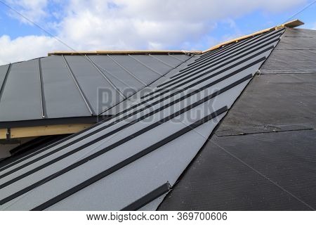 Close-up View Of Seam Roof Under Construction On Waterproofing Layer