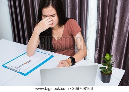 Work From Home, Fatigued Or Strain Asian Business Young Beautiful Woman Sits On Desk Workspace Feeli