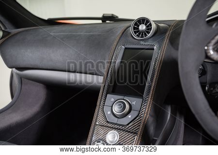 Infotainment System In Black Sports Car Interior