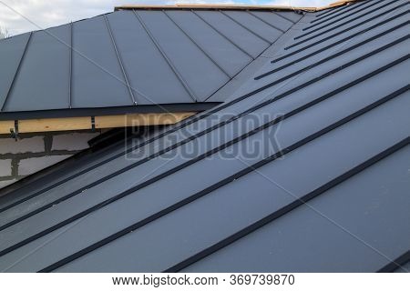 Close Up View Of  House Under Construction With Grey Folding Roof On Waterproofing Layer