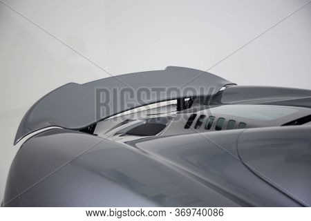 Close Up Of Rear Spoiler On A Dark Silver Sports Car