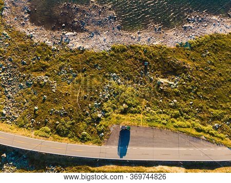 Top Down View. Camper Car On Road, Hardangervidda Mountain Plateau, Norway Landscape. National Touri