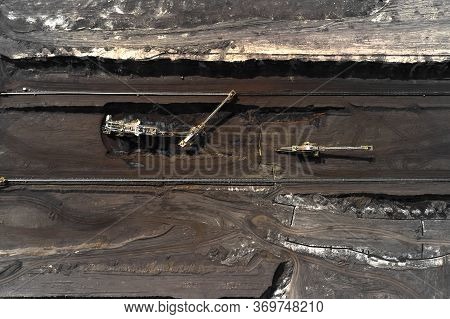 Aerial Shoot Of Quarry With Heavy Bucket Wheel Excavators Mining A Coal. Heavy Industry Concept.