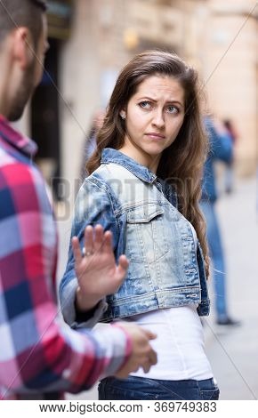 Beautiful Woman Getting Rid Of An Annoying Man Who Is Trying To Pick Her Up On A Street