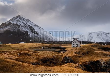 Lonely House On The Basalt Coast And Stapafell Mountain Near The Snfellsjoekull Glacier, Arnarstapi,