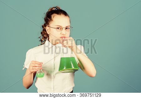 Child Study Bilogy Lesson. Small Smart Girl With Testing Flask. Education And Knowledge. Science Res