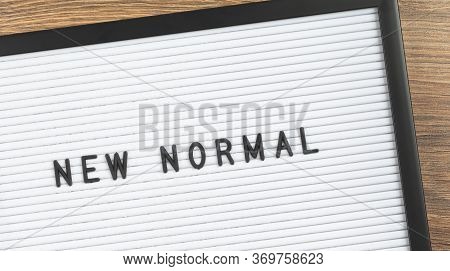 New Normal Text On White Letter Board Background. Adapting To New Life Or Business Post-lockdown Cha