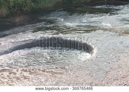 Rock Floor Bathed In Water From A Stream That Drills Large Holes Through The Years, Las Gachas, Guad