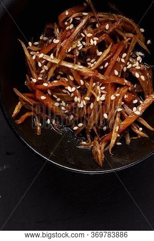 Traditional Japanese Salad Kinpira Gobo. Fried Burdock Root And Carrot With Sesame Seeds. Top View