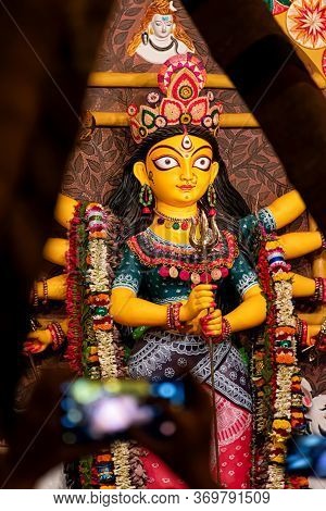 Goddess Durga Idol At Decorated Durga Puja Pandal, Shot At Colored Light, In Kolkata, West Bengal, I