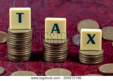 Concept Tax Word Design With Indian Five Rupee Coin For Various Type Of Financial Or Tax Related Tra