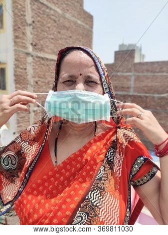 Indian Woman In Saari Wearing Face Mask For Corona Virus Protection.
