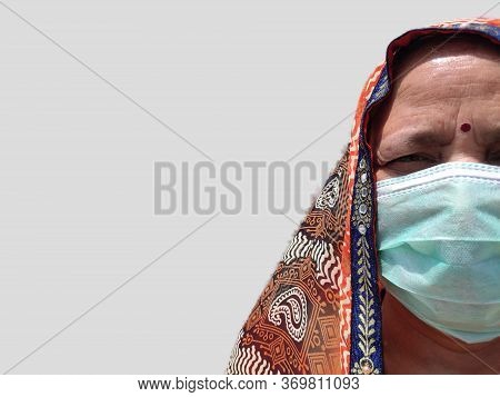 Indian Woman In Saari Wearing Face Mask For Corona Virus Protection.