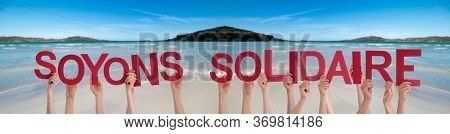 People Hands Holding Soyons Solidaire Means Showing Solidarity, Ocean Background