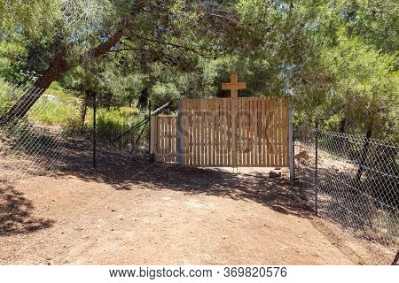 Outdoor Fence With A Large Wooden Cross Enclosing The Monastery Of Lavra Netofa Near The Village Of 
