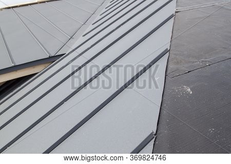 Close Up View Of Grey Folding Roof Under Construction On Waterproofing Layer