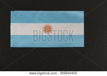 Flag Of Argentina On Black Background. National Symbol Of Argentine Republic.