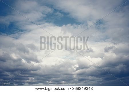 Tinted Dark Blue Sky And Clouds
