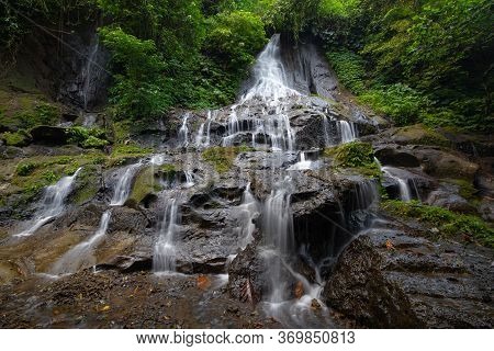 Waterfall Landscape. Beautiful Hidden Goa Giri Campuhan Waterfall In Tropical Rainforest. Adventure 