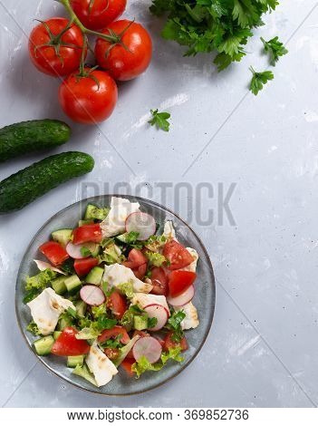 Fattoush Salad In A Gray Plate With Ingredients On A Gray Background. Top View. Vertical Orientation