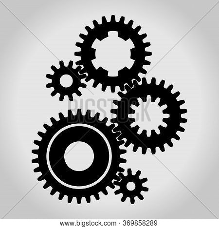 Silhouette Of A Mechanical Gears & Cogwheel Set, Large And Small Sprockets 5 Pieces. Vector Illustra