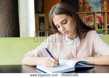 The Girl In The Cafe Makes An Entry In The Diary.